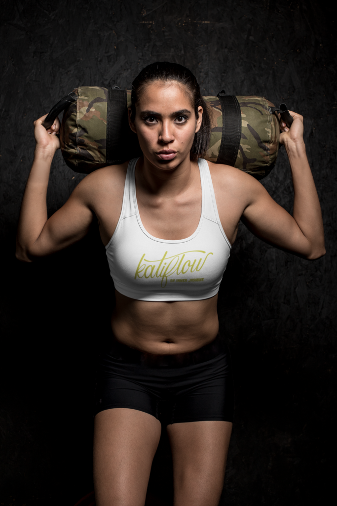 Download sports-bra-mockup-of-a-sportive-woman-holding-a-weight-bag ...